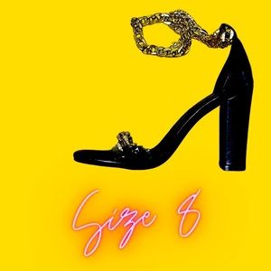 Black heels with gold chain like strap